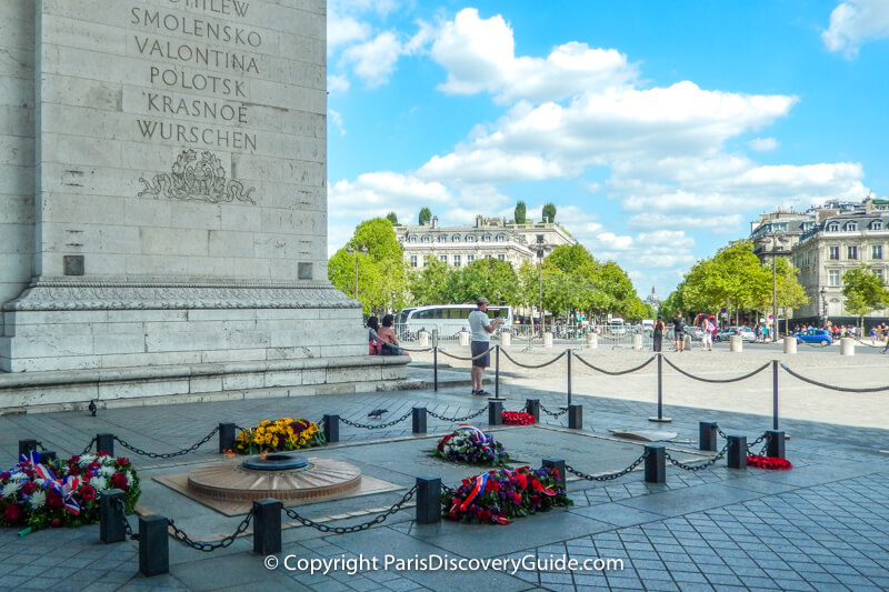 Eternal flame at the Tomb of the Unknown Soldier under the Arc de Triomphe in Paris Eternal flame at the Tomb of the Unknown Soldier under the Arc de Triomphe in Paris