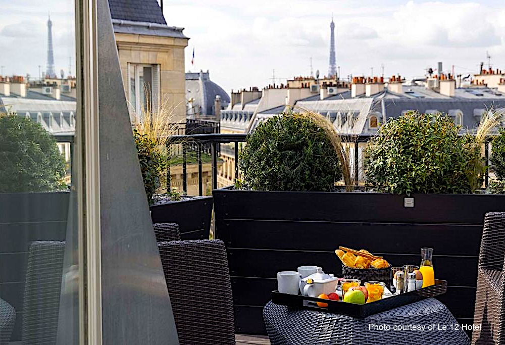 View of the Eiffel Tower from a guestroom terrace at Le 12 Hotel