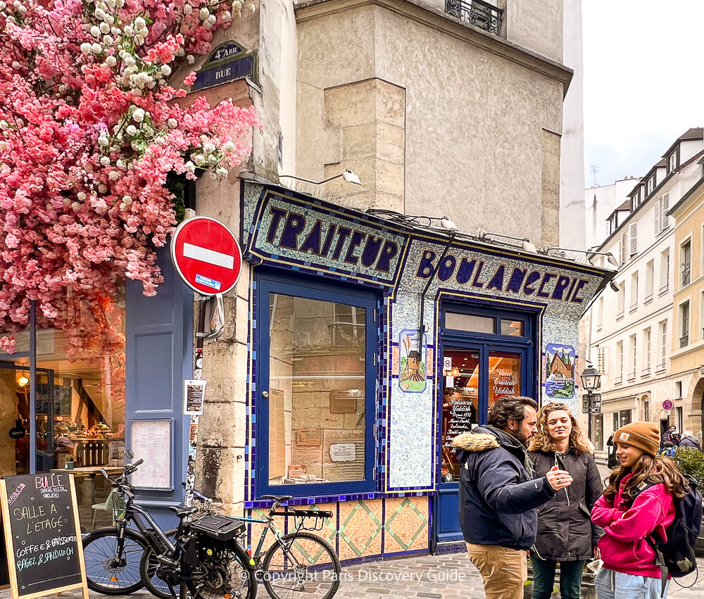 (Fake) cherry blossoms brighten a corner on Rue des Rosiers in Le Marais in early March