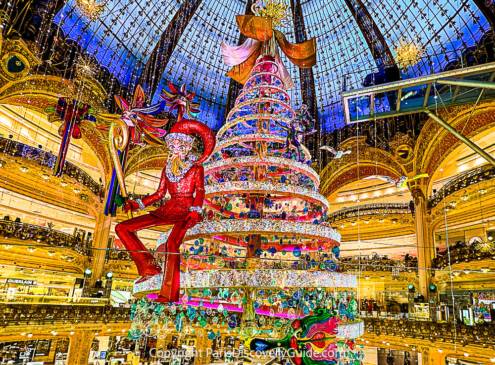 Christmas decorations and lights suspsended from the skylight dome in Galeries Lafayette