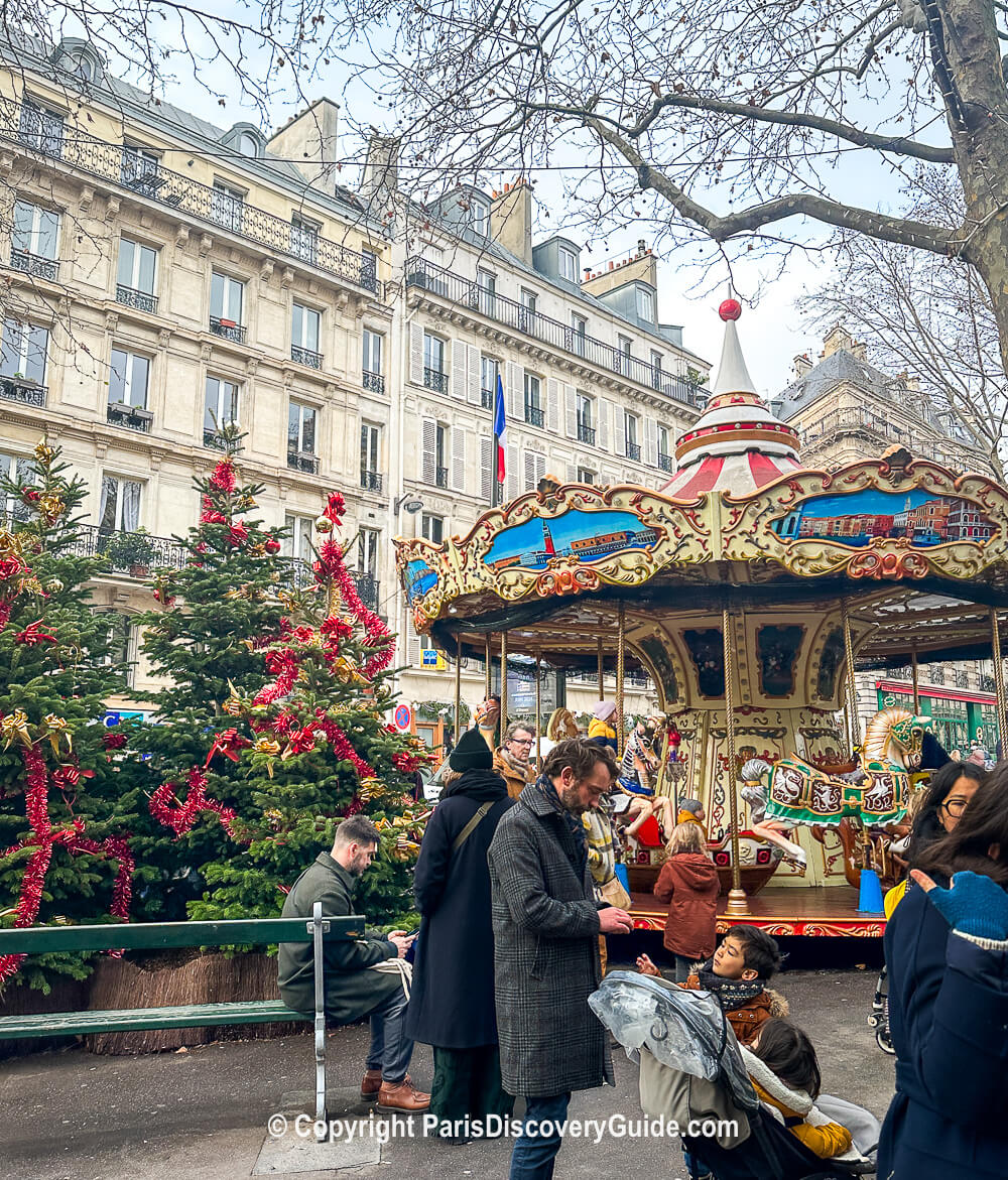 Carousel and Christmas trees on Rue des Martyrs