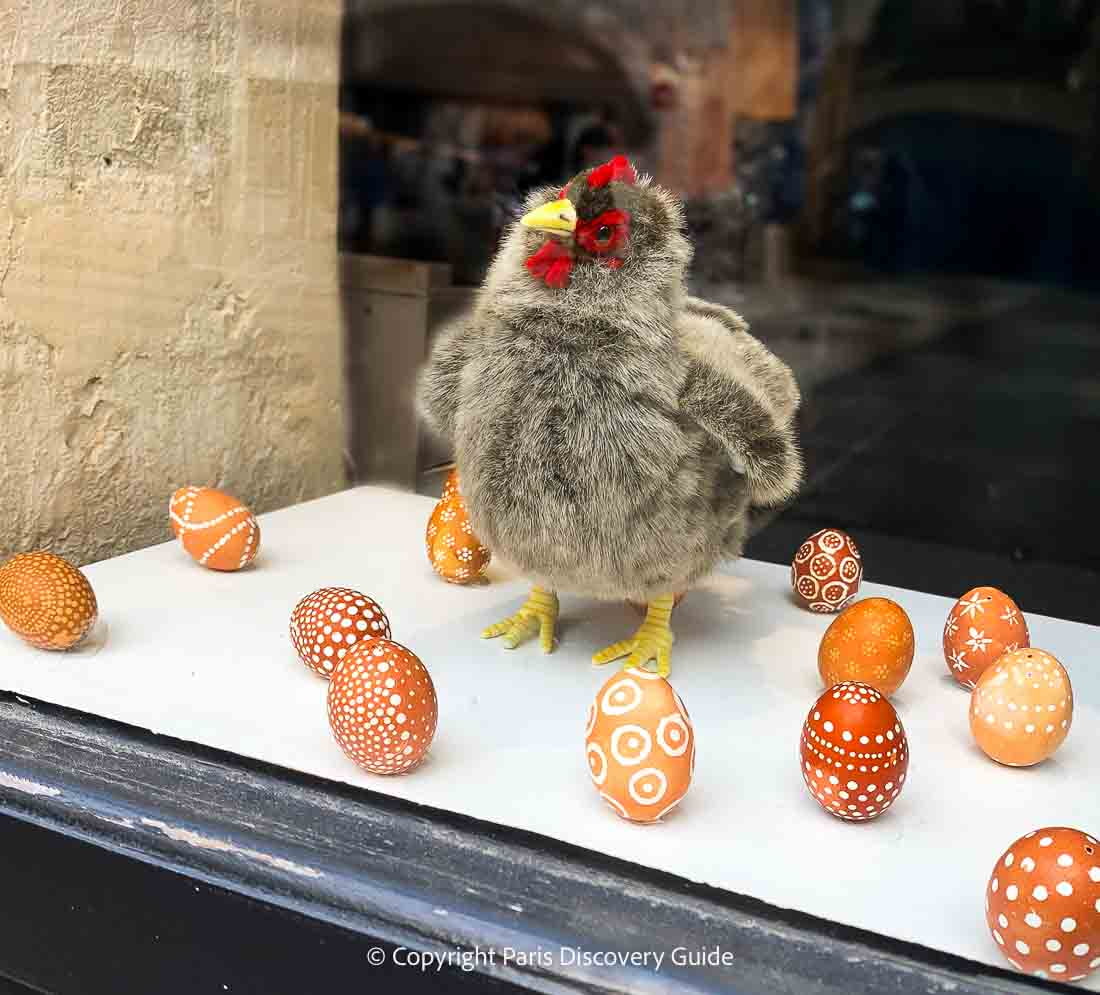 Chicken with decorated chocolate eggs in a shop window in the Marais neighborhood