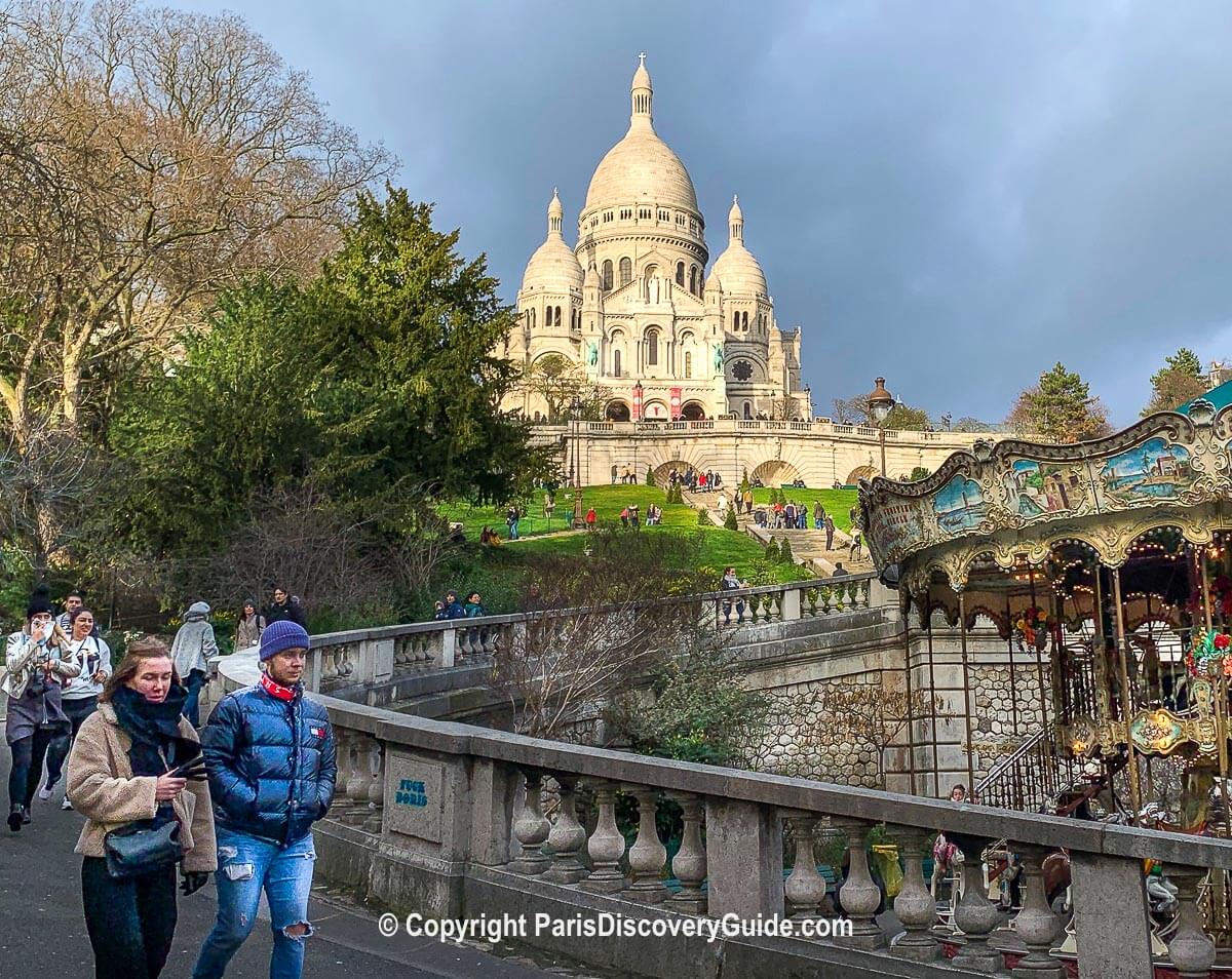 The Carrousel de Saint-Pierre in Square Louise Michel, the leafy park below Sacre Coeur Basilica The Carrousel de Saint-Pierre in Square Louise Michel, the leafy park below Sacre Coeur Basilica