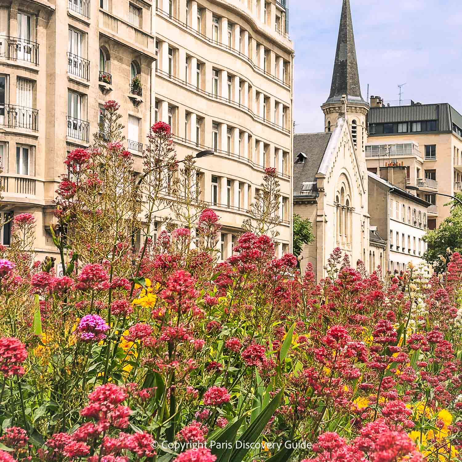 Flowers blooming in a public square in the Batignolles neighborhood in Paris's 17th Arrondissement Flowers blooming in a public square in the Batignolles neighborhood in Paris's 17th Arrondissement