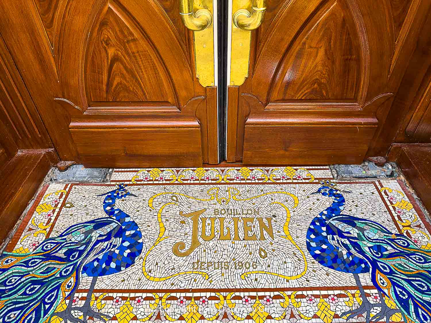 The original mosaic entrance with blue peacocks at Bouillon Julien