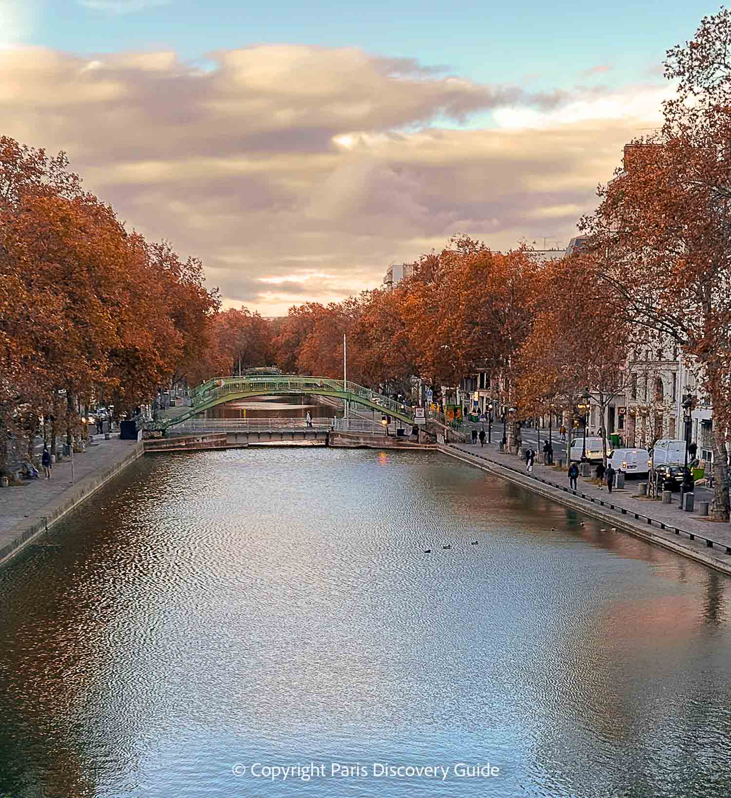 Fall foliage along Canal Saint-Martin, viewed from a bridge