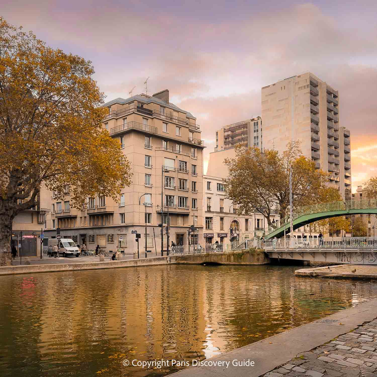 Fall foliage along Canal Saint-Martin at sunset