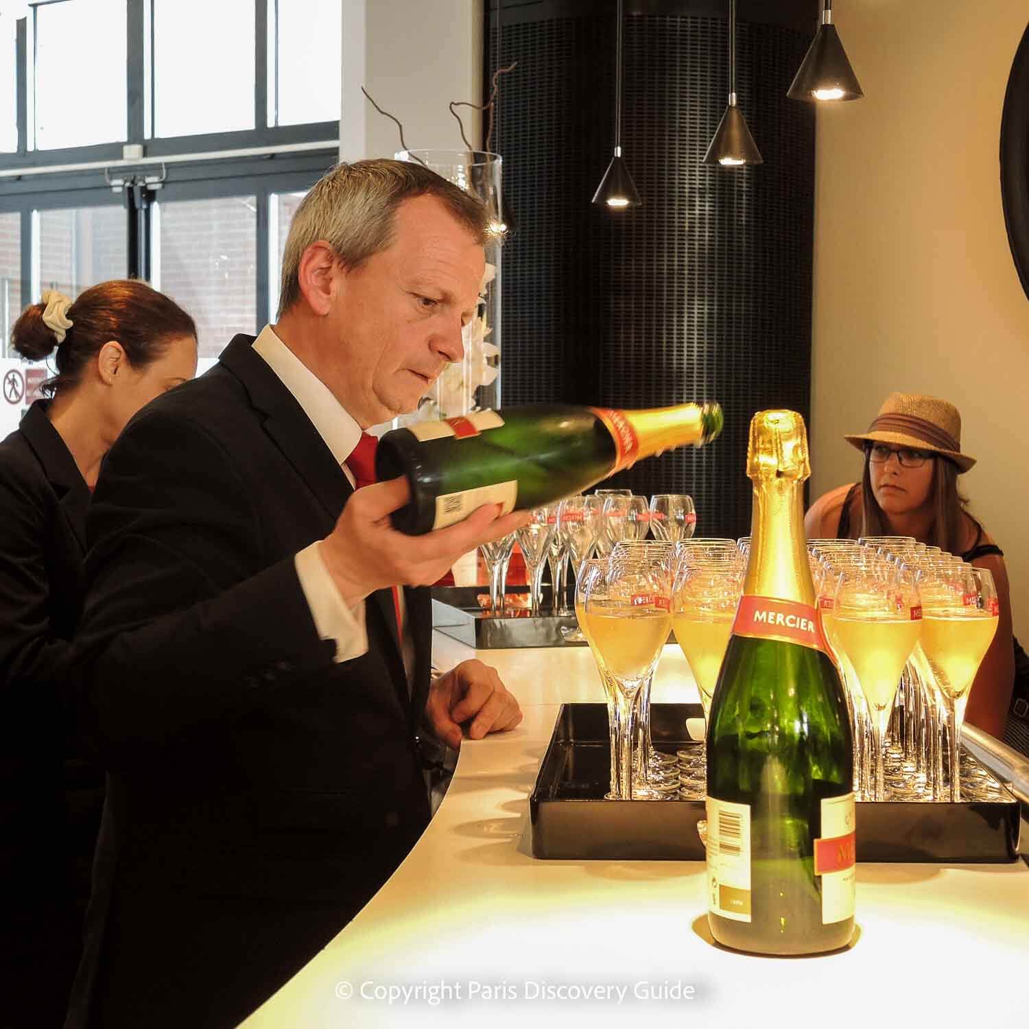 Glasses of Mercier Champagne being poured during a Champagne Day Trip from Paris
