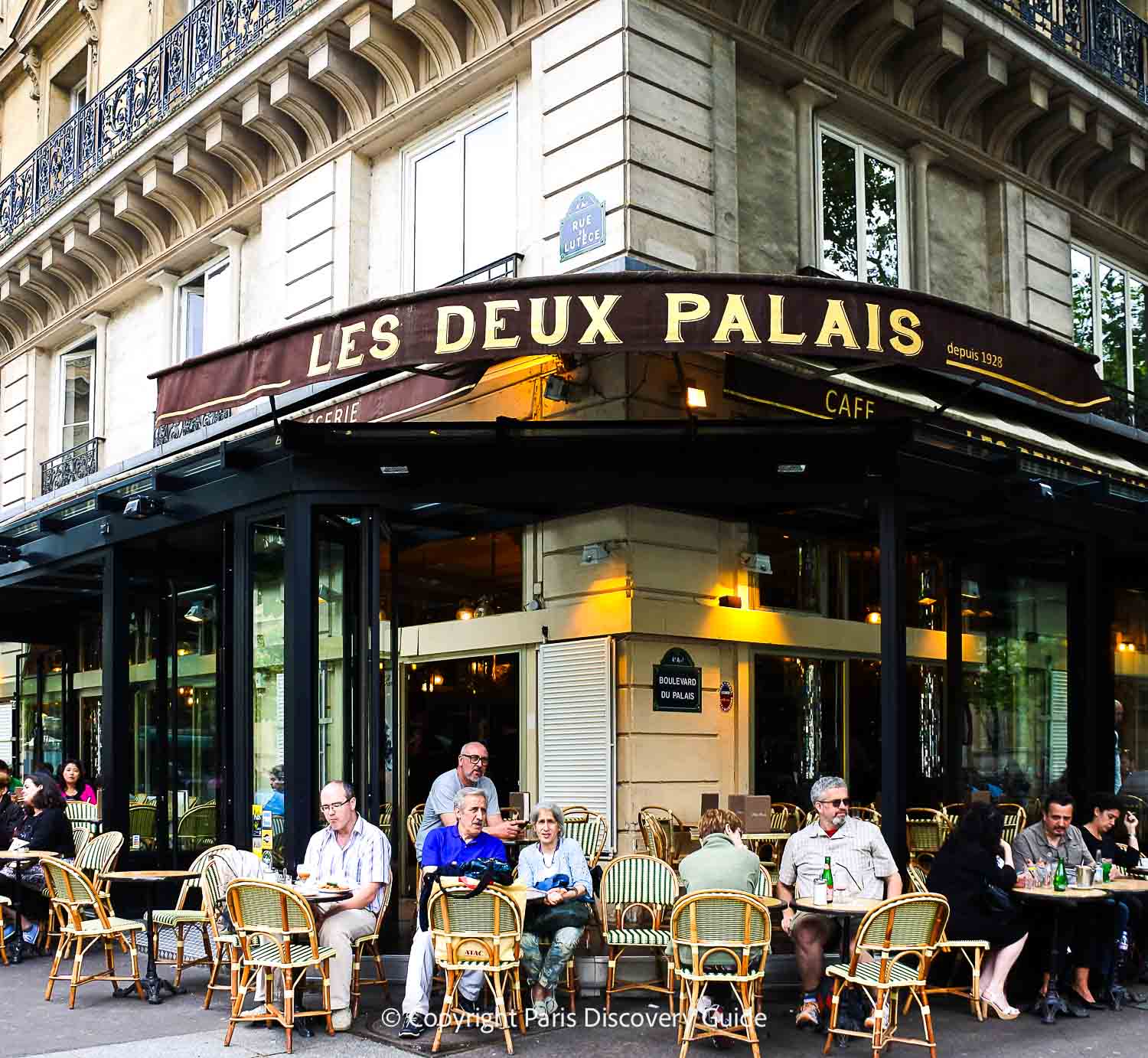 Sunny (but covered) cafe terrace across the street from Sainte-Chapelle and the Concergerie - a good place for a refreshing drink or light meal on Ile de la Cite Sunny (but covered) cafe terrace across the street from Sainte-Chapelle and the Concergerie - a good place for a refreshing drink or light meal on Ile de la Cite