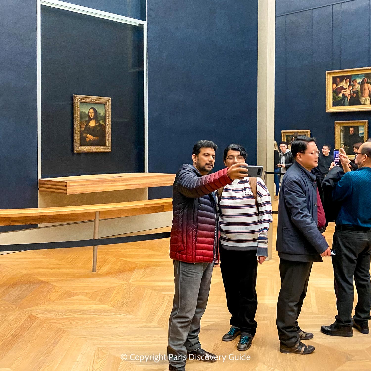 Mona Lisa on display in a bullet-proof glass case in the Louvre 