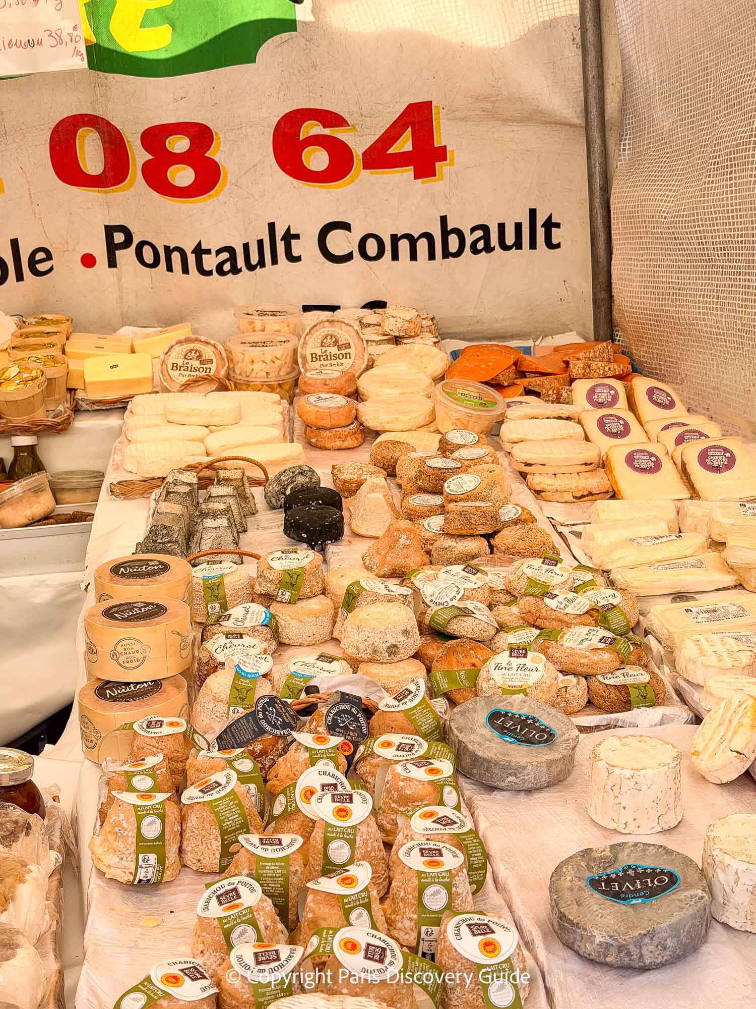 Cheeses, mostly chevre (goat cheese) in this section, at La Petite Fermièr stall at Marché Monge