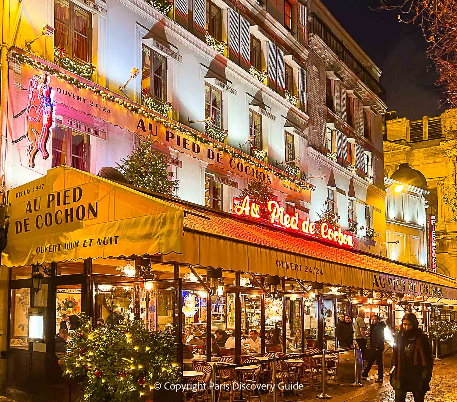 Au Pied de Cochon (cochon=pig) at night 