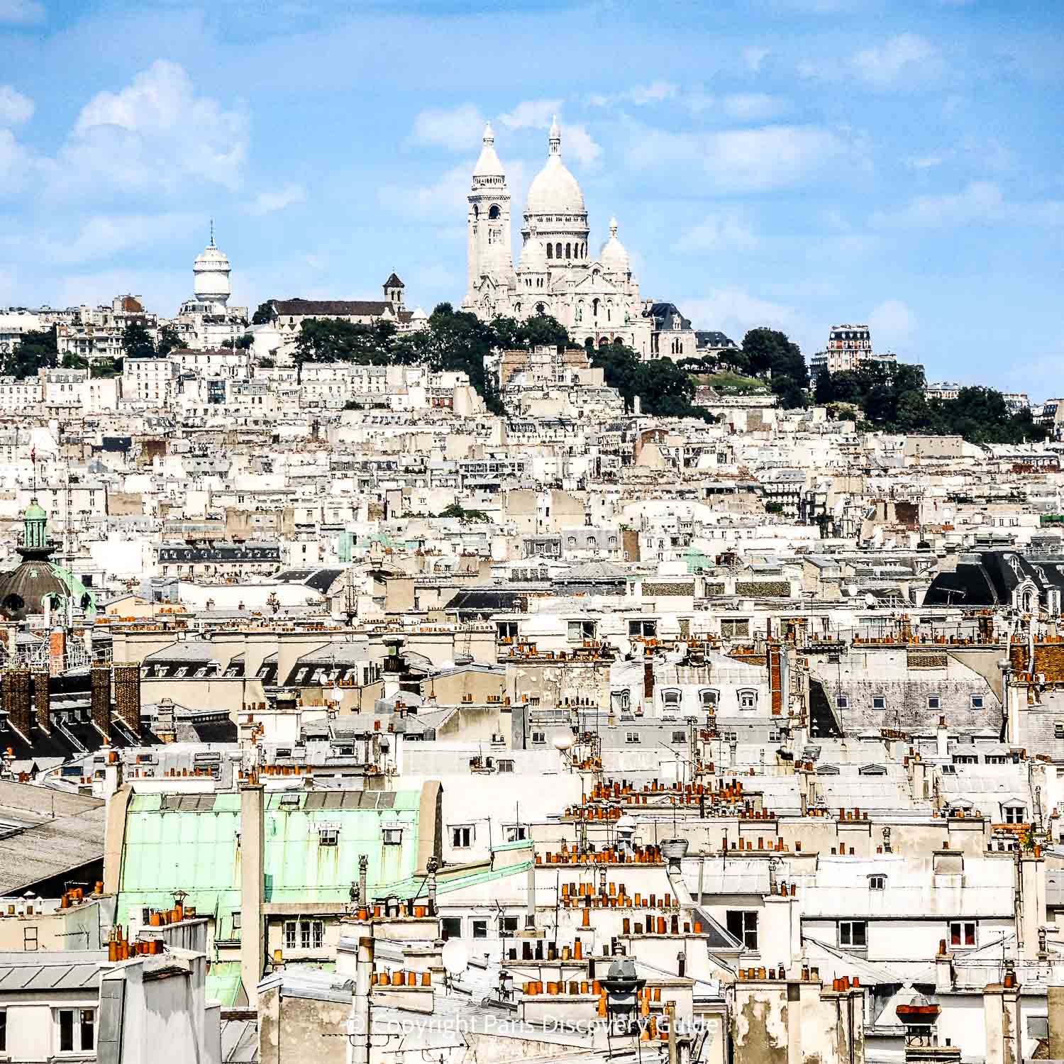 View of Sacre Coeur and Montmartre from the ferris wheel in Tuileries Garden