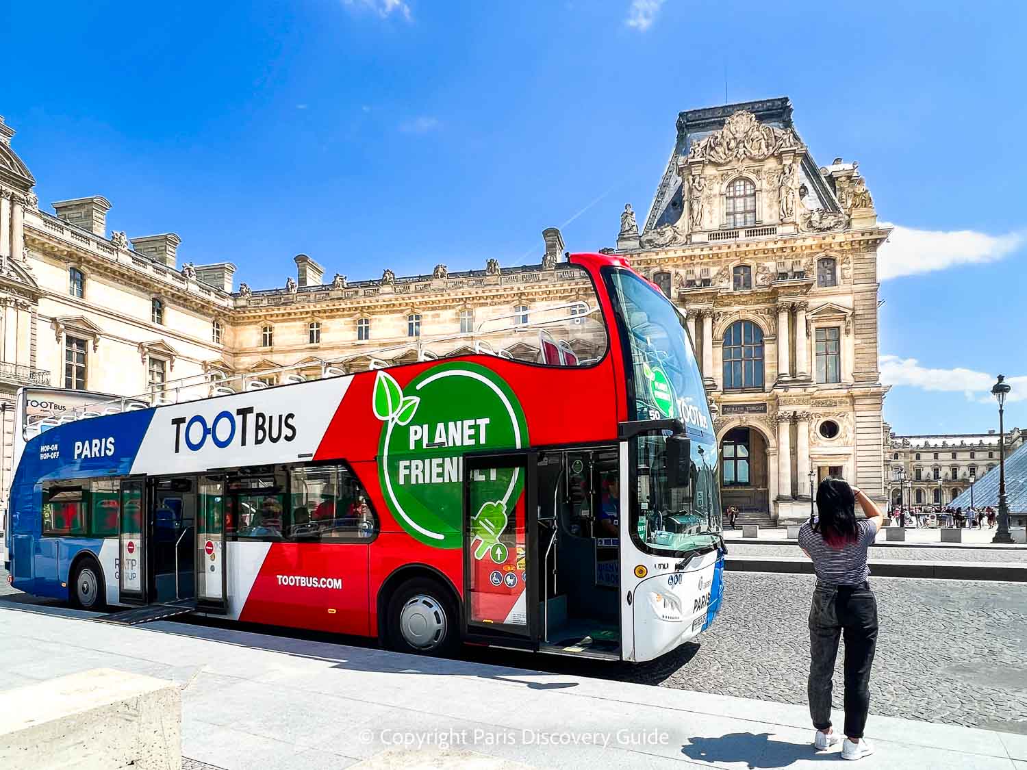 Tootbus, with Palais du Louvre in the background