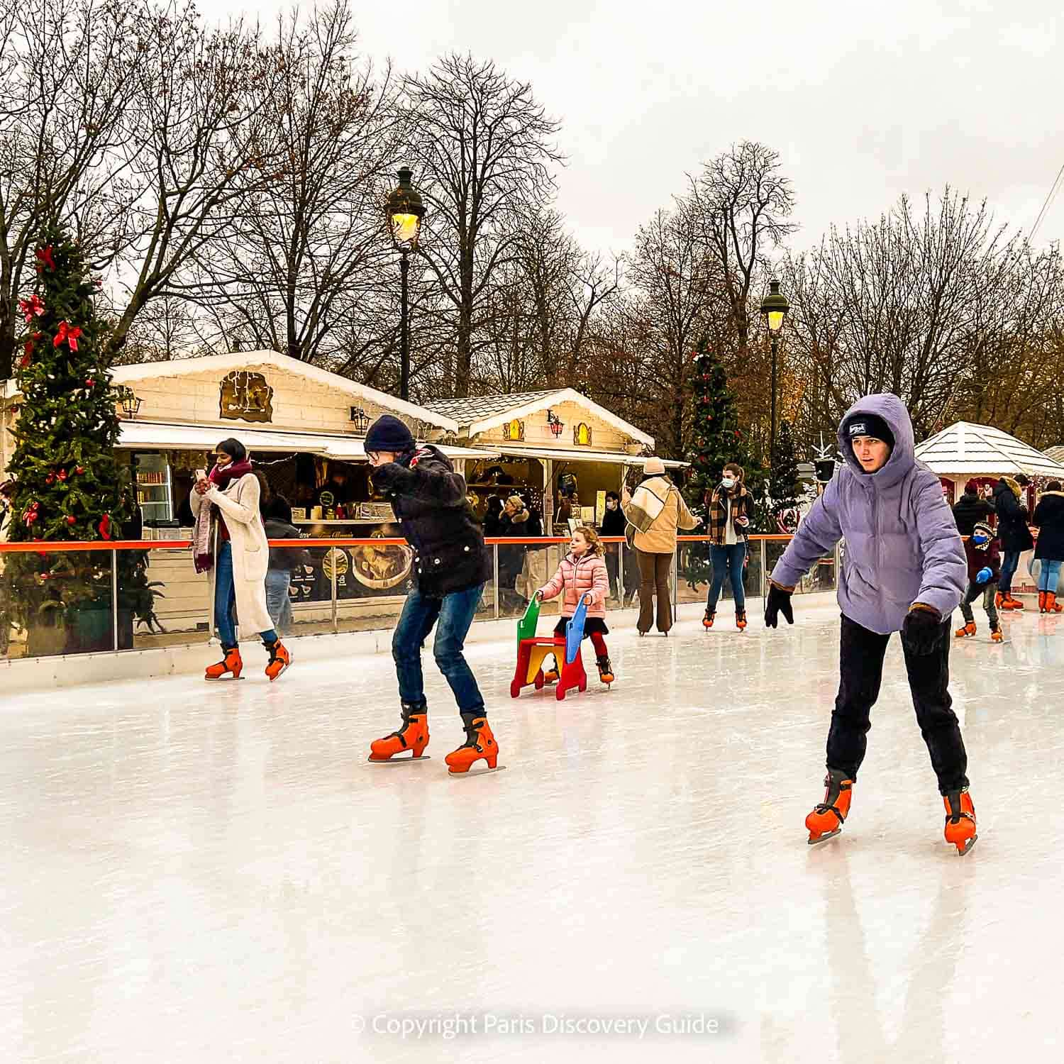 Skaters on the 'ice rink' at Tuileries Garden Christmas Market 