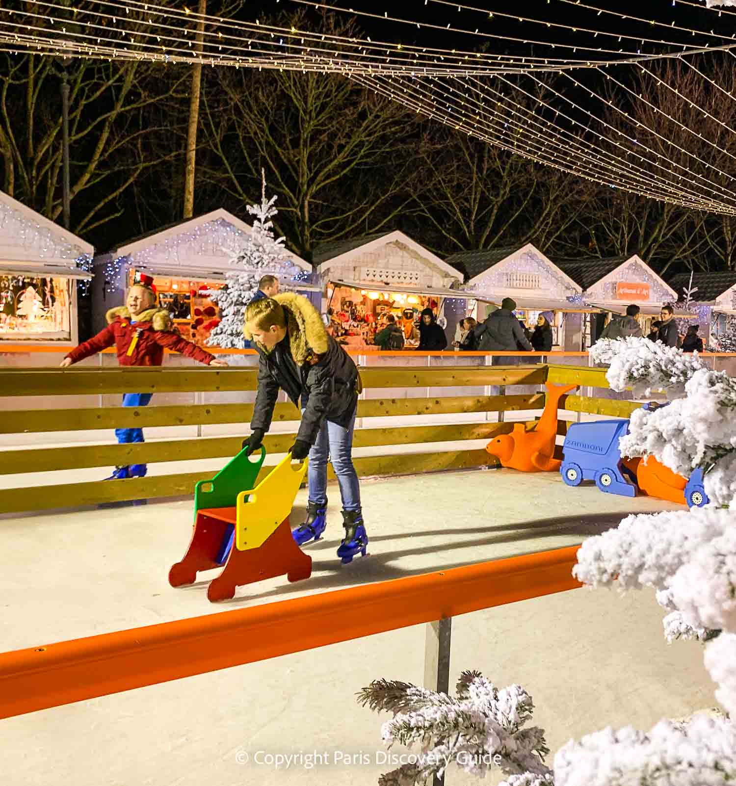 Ice rink and skaters at Tuileries Garden Christmas Market