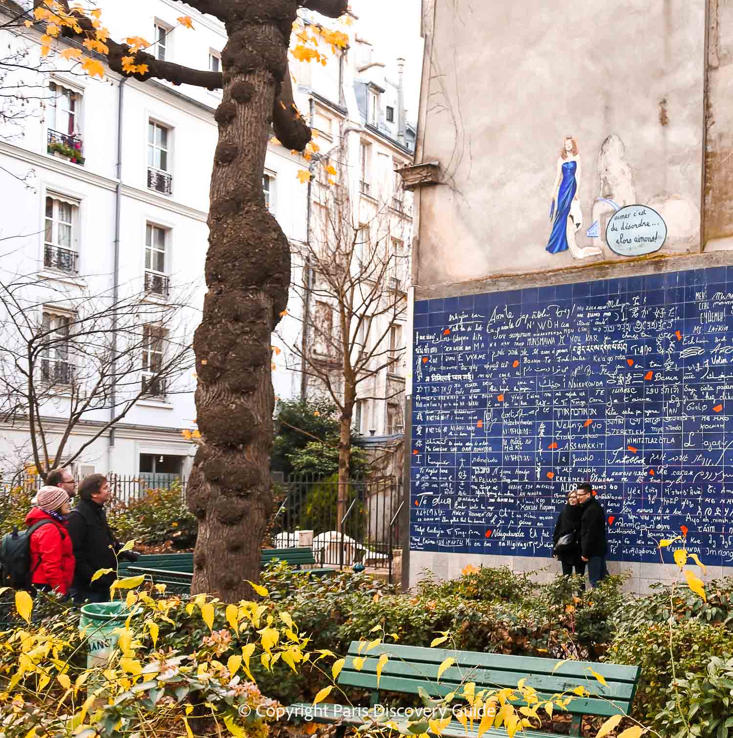 Gold and orange fall foliage by the Wall of Love in Montmartre