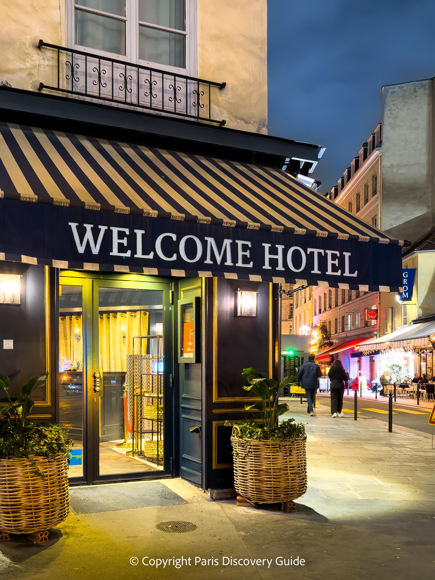 Evening view of Welcome Hotel and Rue de Seine