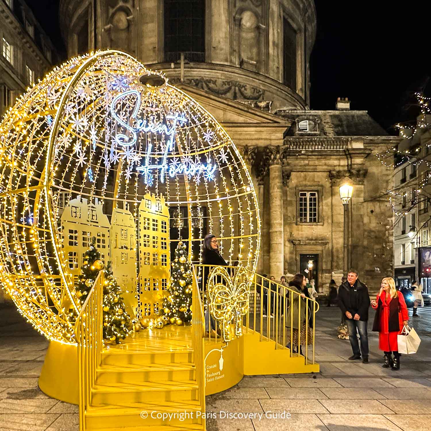 Christmas-themed photo op on Rue Saint-Honoré near Rue Cambon and designer boutiques in the 1st arrondissement