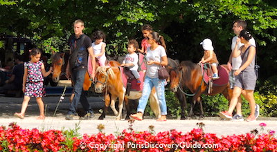 Pony rides for children at Square Georges Brassens in Paris Pony rides for children at Square Georges Brassens in Paris