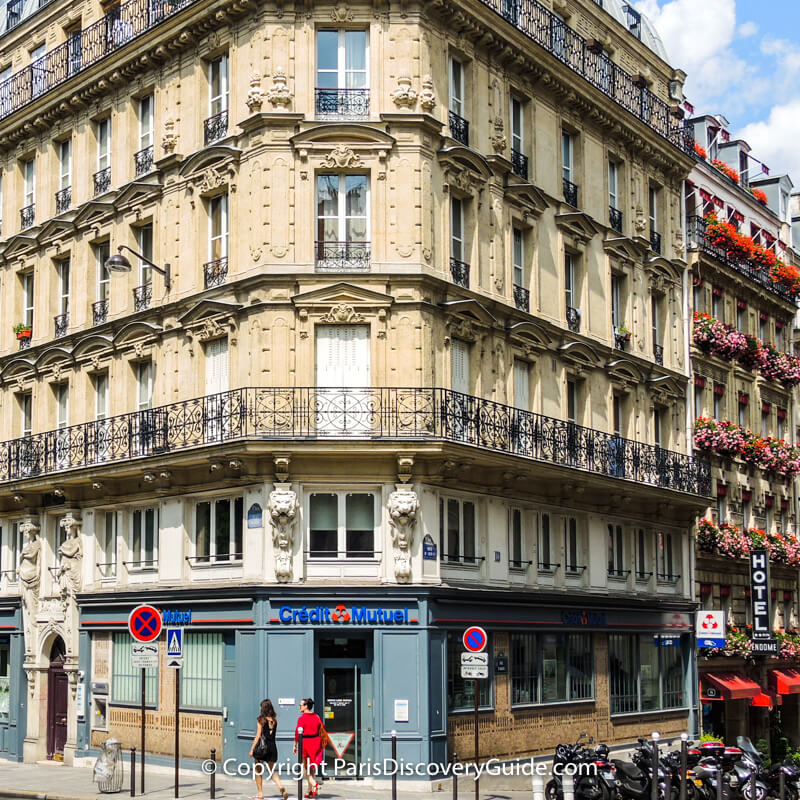 ATM machine (inset in stone wall near door in lower left corner) at Crédit Mutuel on Rue Monge in Paris's 5th arrondissement