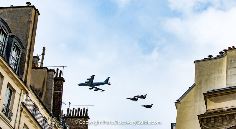 Bastille Day military flyover seen from rue Molière near Palais Royal  