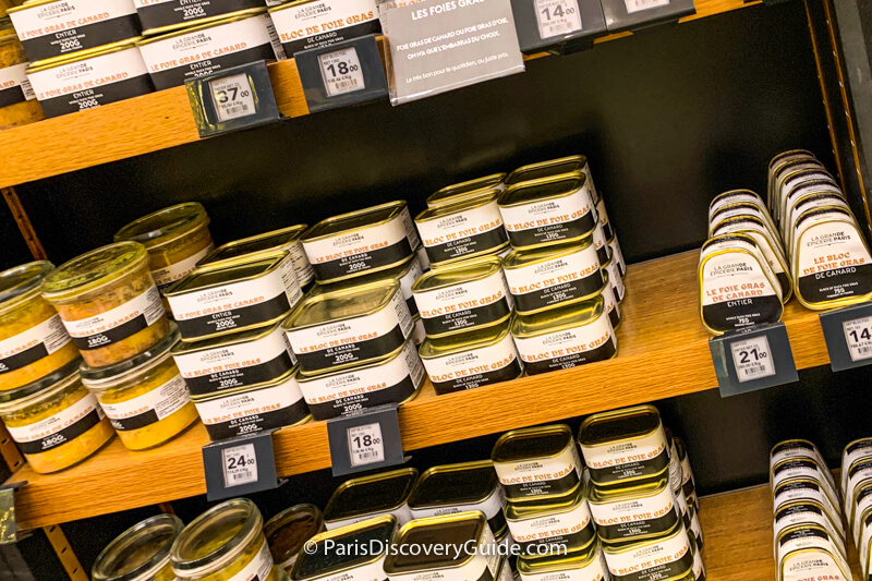 Tins of foie gras displayed in Bon Marché's La Grande Épicerie de Paris on Rue de Sèvres Tins of foie gras displayed in Bon Marché's La Grande Épicerie de Paris on Rue de Sèvres