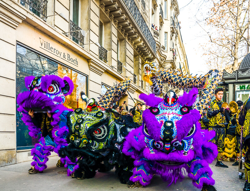 Chinese New Year parade with lion dancers and dragons - Photo credit: iStock/Oigres8