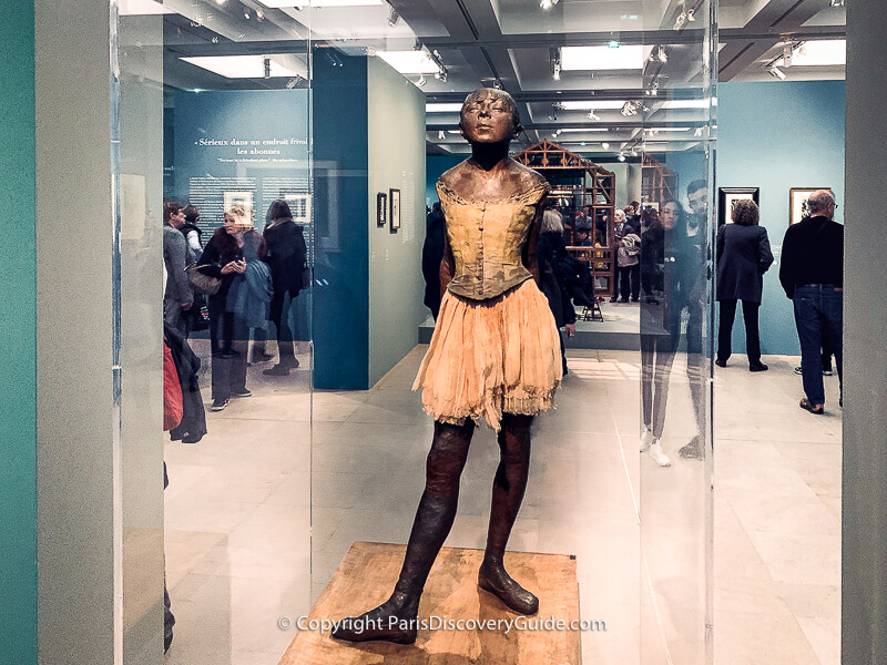 Edgar Degas exhibited "Petite Danseuse de 14 Ans" (Small Dancer, Aged Fourteen) in an 1881 Impressionist exhibition Edgar Degas exhibited "Petite Danseuse de 14 Ans" (Small Dancer, Aged Fourteen) in an 1881 Impressionist exhibition