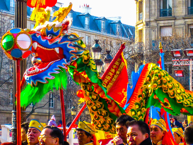 Marchers carrying flags in Paris Chinese New Year Parade Marchers carrying flags in Paris Chinese New Year Parade