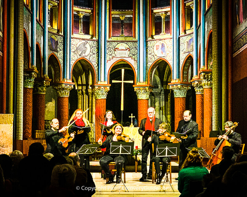 Musicians playing Christmas concert at Eglise Saint Germain des Prés Musicians playing Christmas concert at Eglise Saint Germain des Prés