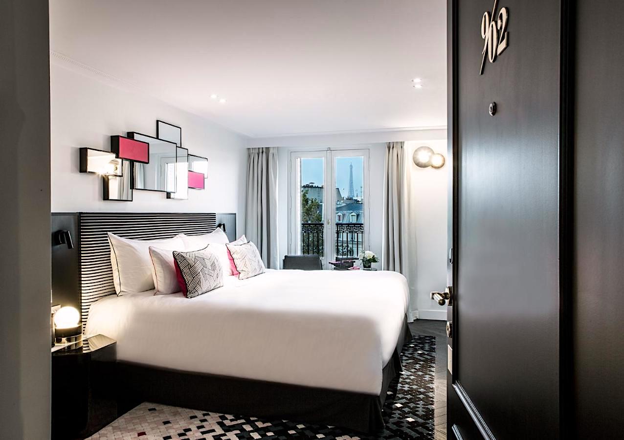 Guestroom with balcony and Eiffel Tower view at Hôtel Fauchon Guestroom with balcony and Eiffel Tower view at Hôtel Fauchon