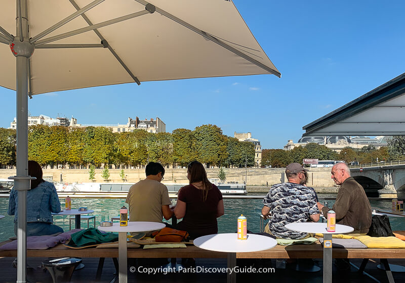 Seine-side terrace at Fluctuart, floating art gallery in 7th arrondissement Seine-side terrace at Fluctuart, floating art gallery in 7th arrondissement