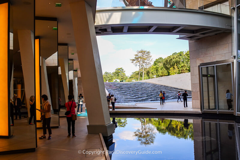 Cascading water and reflecting pool at Louis Vuitton Foundation Cascading water and reflecting pool at Louis Vuitton Foundation