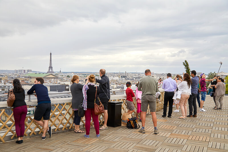 View of Eiffel Tower and Paris skyline from Galerie Lafayette's rooftop terrace - Photo credit: iStock.com/AndreaAstes View of Eiffel Tower and Paris skyline from Galerie Lafayette's rooftop terrace - Photo credit: iStock.com/AndreaAstes