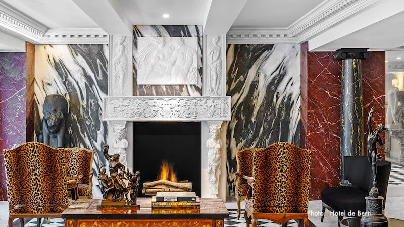 Fireplace in a corner of Hôtel de Berri's expansive and luxurious lobby