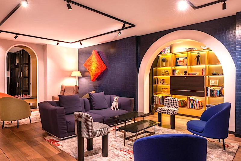 Lobby seating and bookcase at Hotel de Noailles in Paris 2