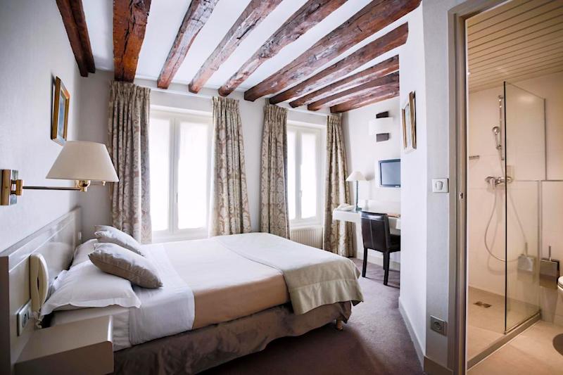 Original ceiling beams in a guest room at Logis La Residence Du Berry Hotel Original ceiling beams in a guest room at Logis La Residence Du Berry Hotel