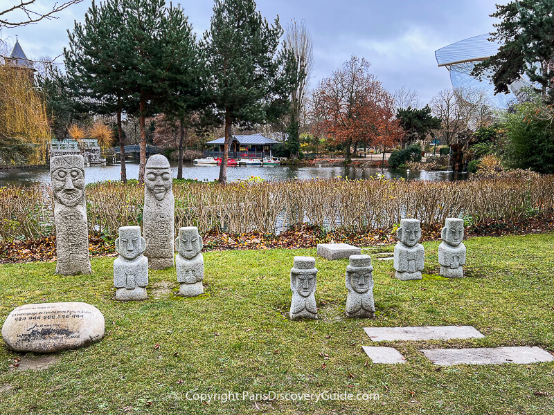 Sculptures in the Korean Garden at Jardin d'Acclimatation in Bois de Boulogne Sculptures in the Korean Garden at Jardin d'Acclimatation in Bois de Boulogne