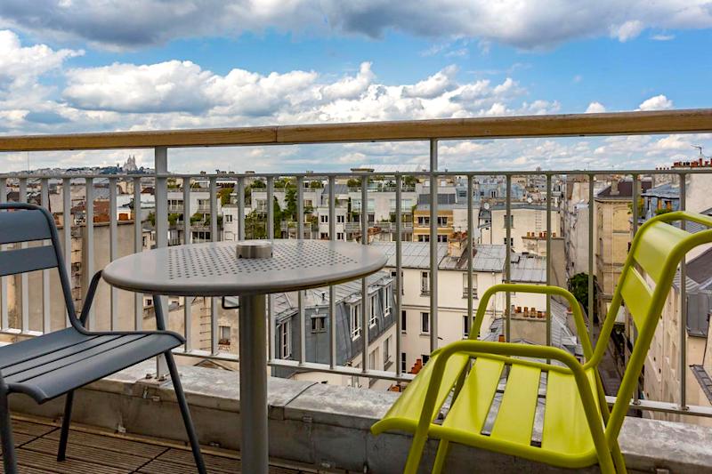 View of Paris rooftops from Jules et Jim guest room balcony View of Paris rooftops from Jules et Jim guest room balcony