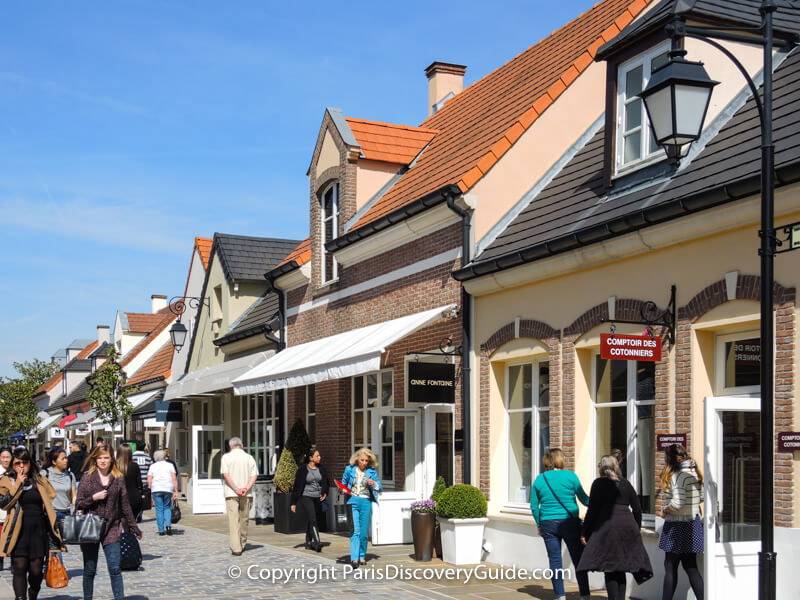 Shoppers and designer boutiques in Paris discount mall La Vallée Village