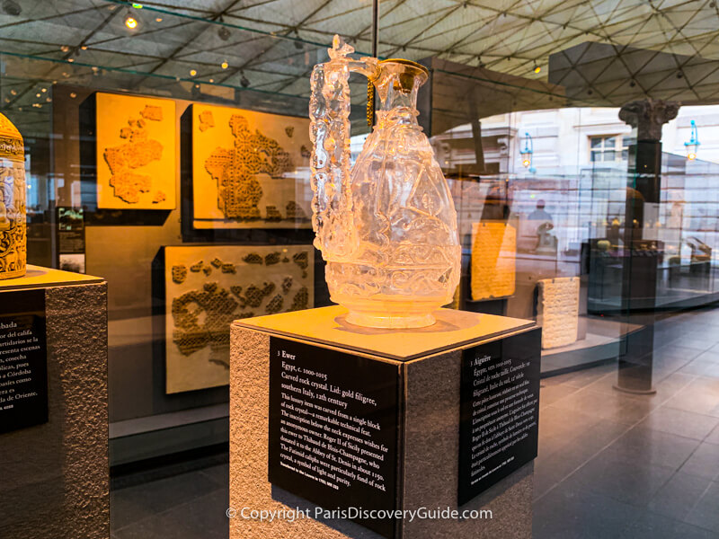 11th century Egyptian vase carved from a single block of rock crystal with a gold filigree lid in the Louvre's Islamic Galleries