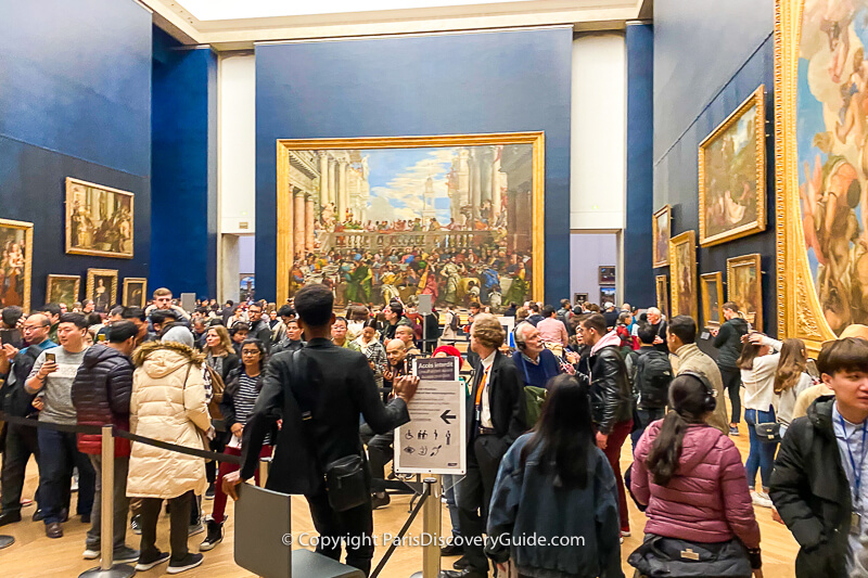 The front part of the line to see Mona Lisa - the rest of the line continues beyond the back wall