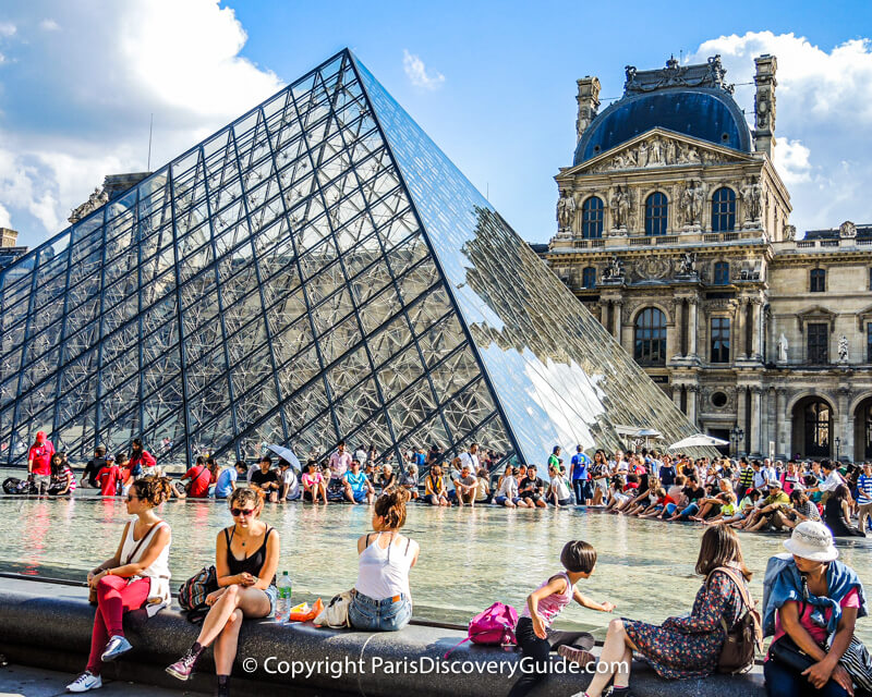 Reflecting pool next to the Musée eu Louvre's glass pyramid on a beautiful July afternoon Reflecting pool next to the Musée eu Louvre's glass pyramid on a beautiful July afternoon