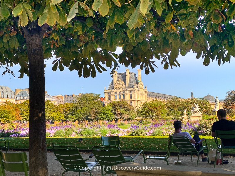 Tuileries Garden, with views of the Louvre and rooftops in the distance Tuileries Garden, with views of the Louvre and rooftops in the distance
