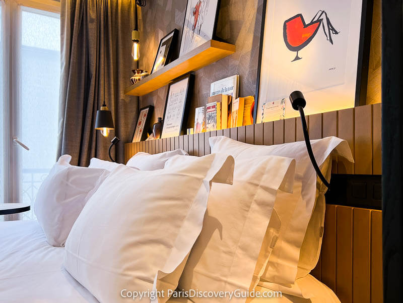 Comfortable bed and pillows at Maison Mère hotel in Paris's 9th arrondissement