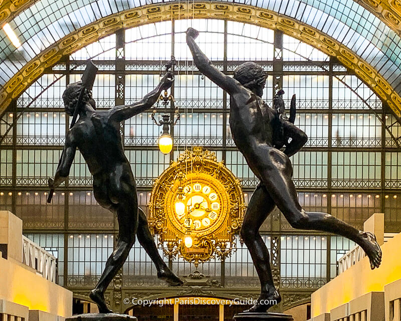Statues and golden clock at the Orsay Museum