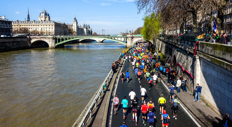 Paris Marathon runners along the Seine River Paris Marathon runners along the Seine River