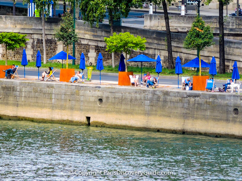 Beach chairs and umbrellas on the Right Bank of the Seine