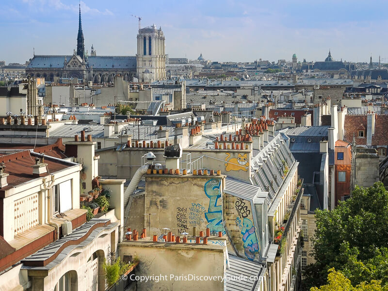 Skyline view of Notre Dame spire and towers before the fire from Centre Pompidou rooftop 